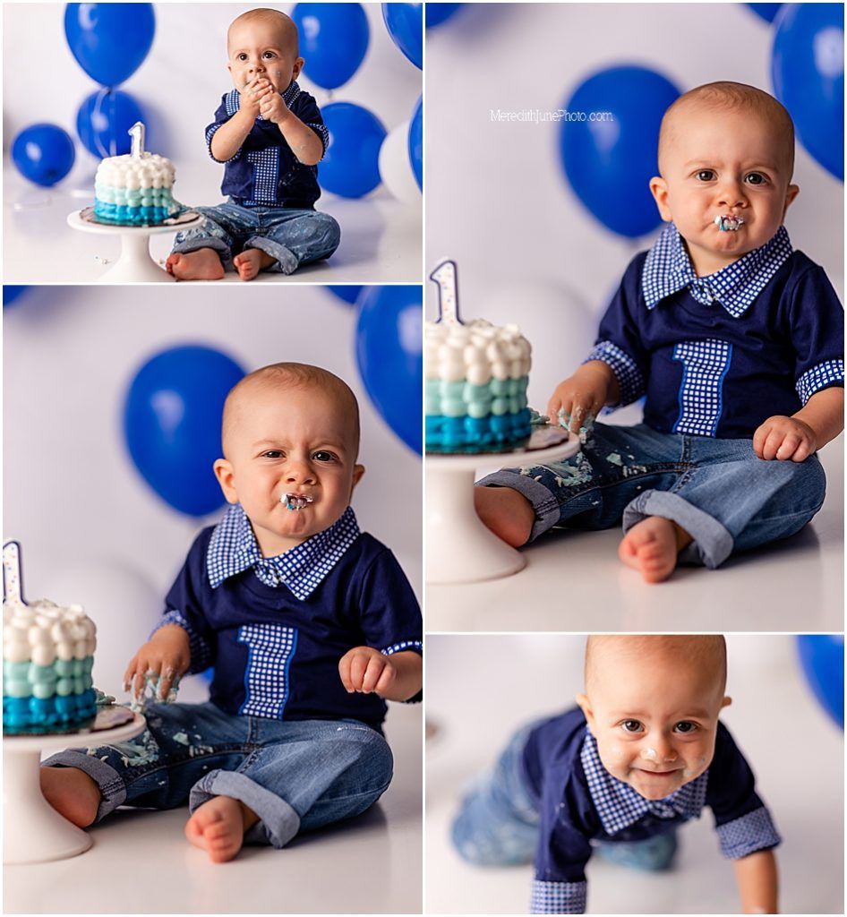 Baby in blue gingham outfit sits with birthday cake and blue balloons for first birthday photoshoot.