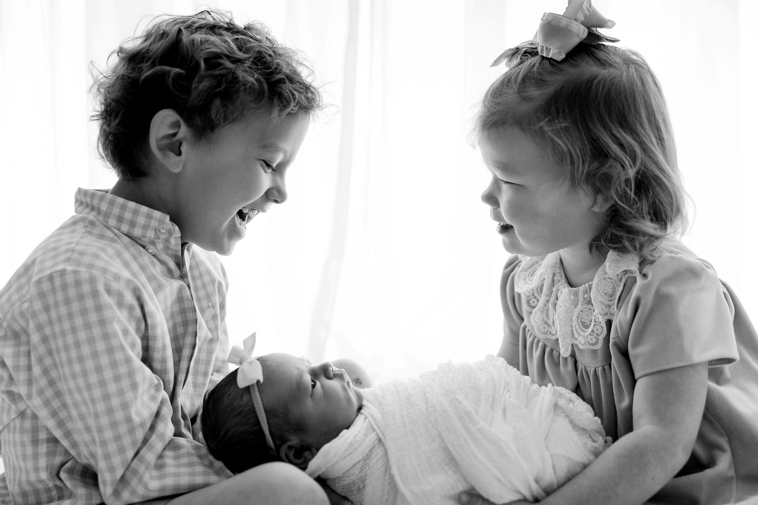 A black and white photo collage shows tender moments between a parent and child in various candid poses.