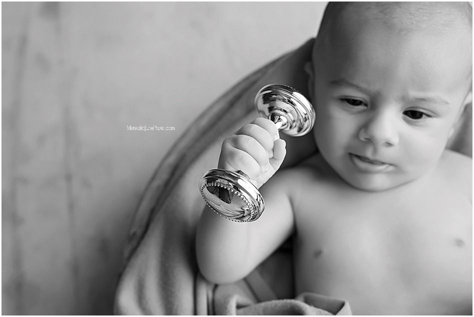 Black and white artistic photo series showing a baby with a stuffed toy in various intimate poses.