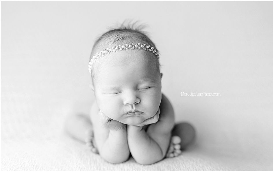 Artistic black and white newborn photography series showing peaceful sleeping baby in minimalist style.