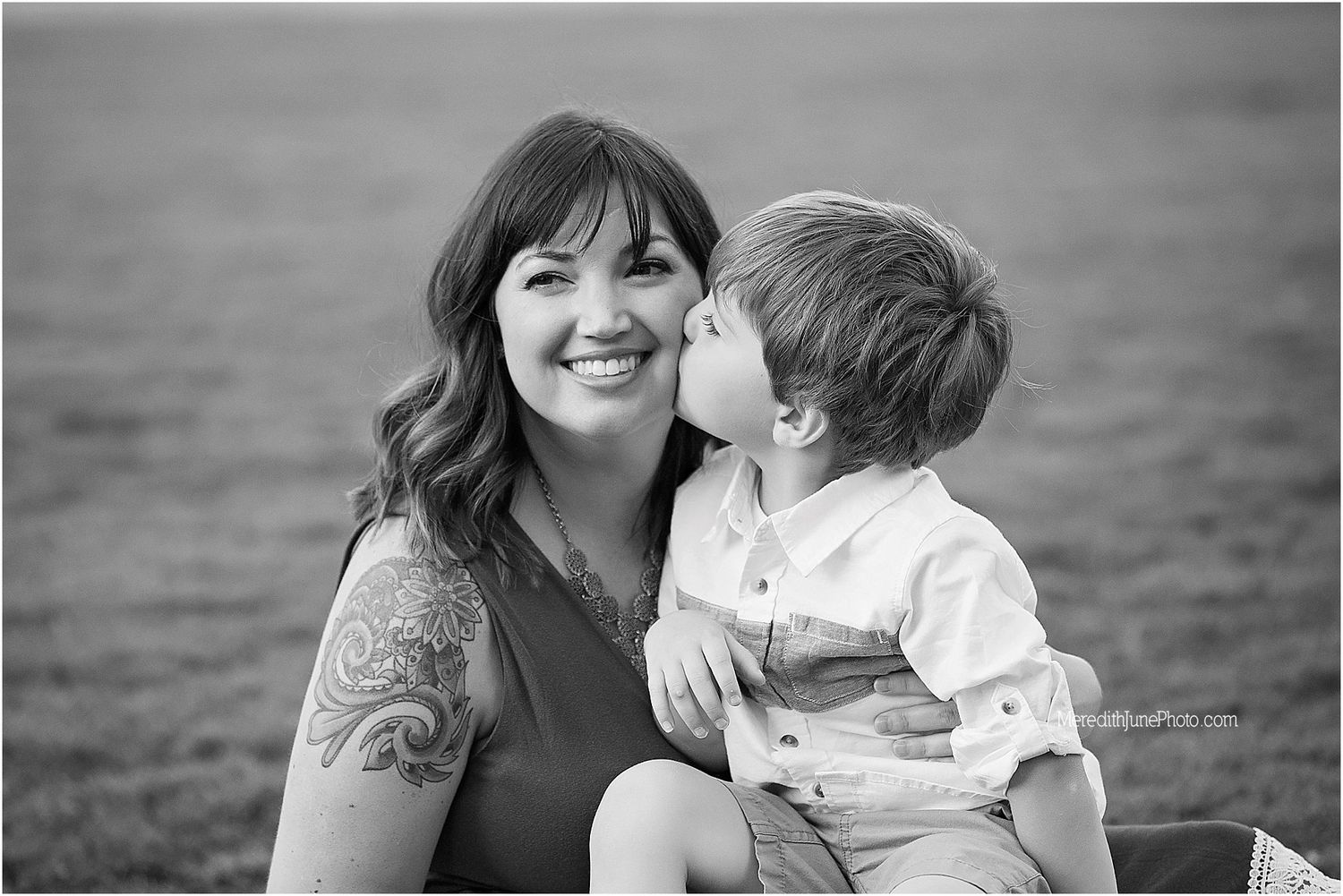 Black and white family portraits showing tender moments and laughter.