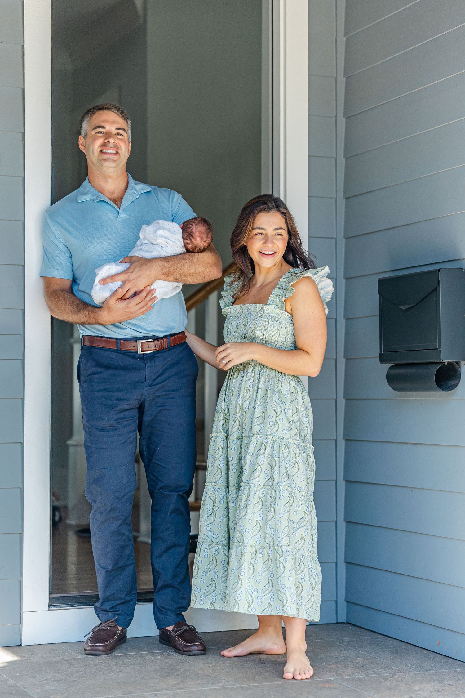 A creative photo sequence showing the same couple on their porch holding a baby in four different poses.