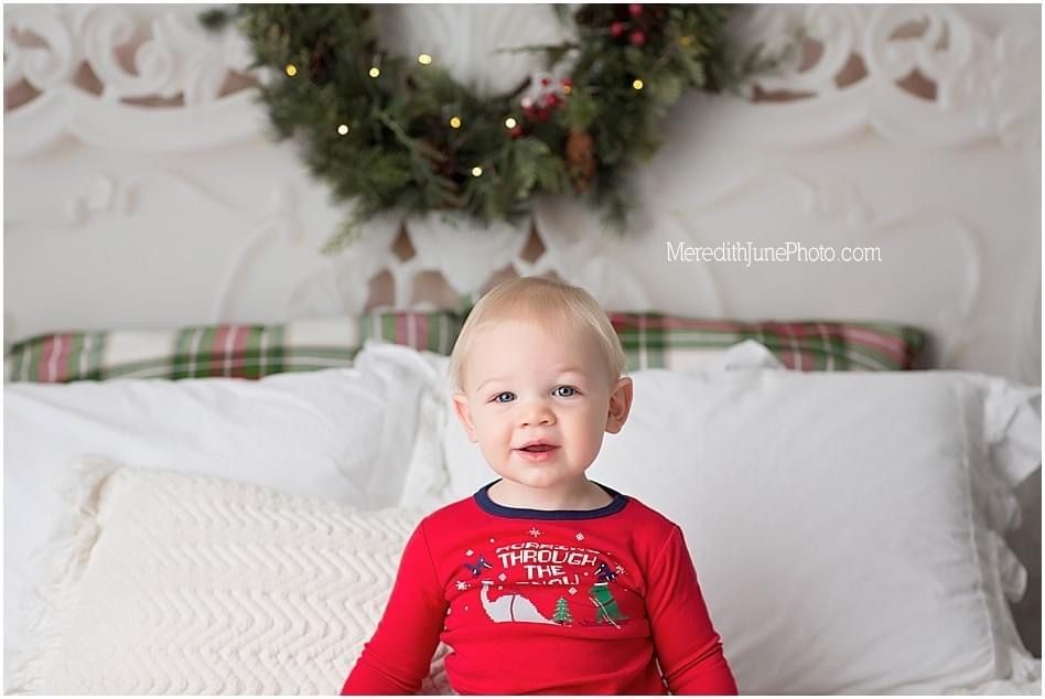 A festive holiday photo collage showing Christmas decorations and someone wearing a red sweater.