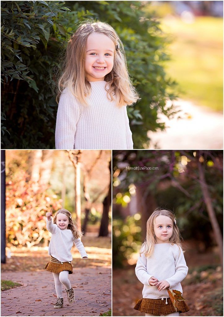 Child in white sweater and brown skirt playing outdoors during golden hour autumn photoshoot.