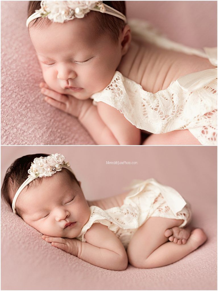 Newborn baby in cream lace outfit sleeping peacefully on pink backdrop during professional photo session.