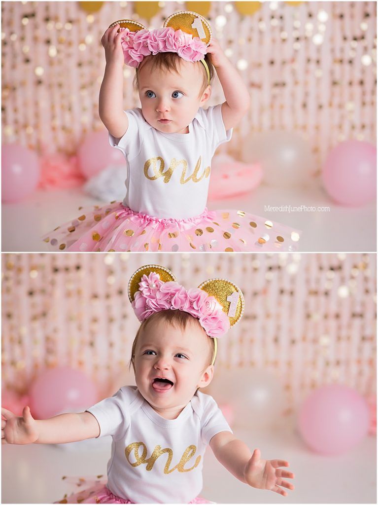 A baby wearing a pink tutu, white 