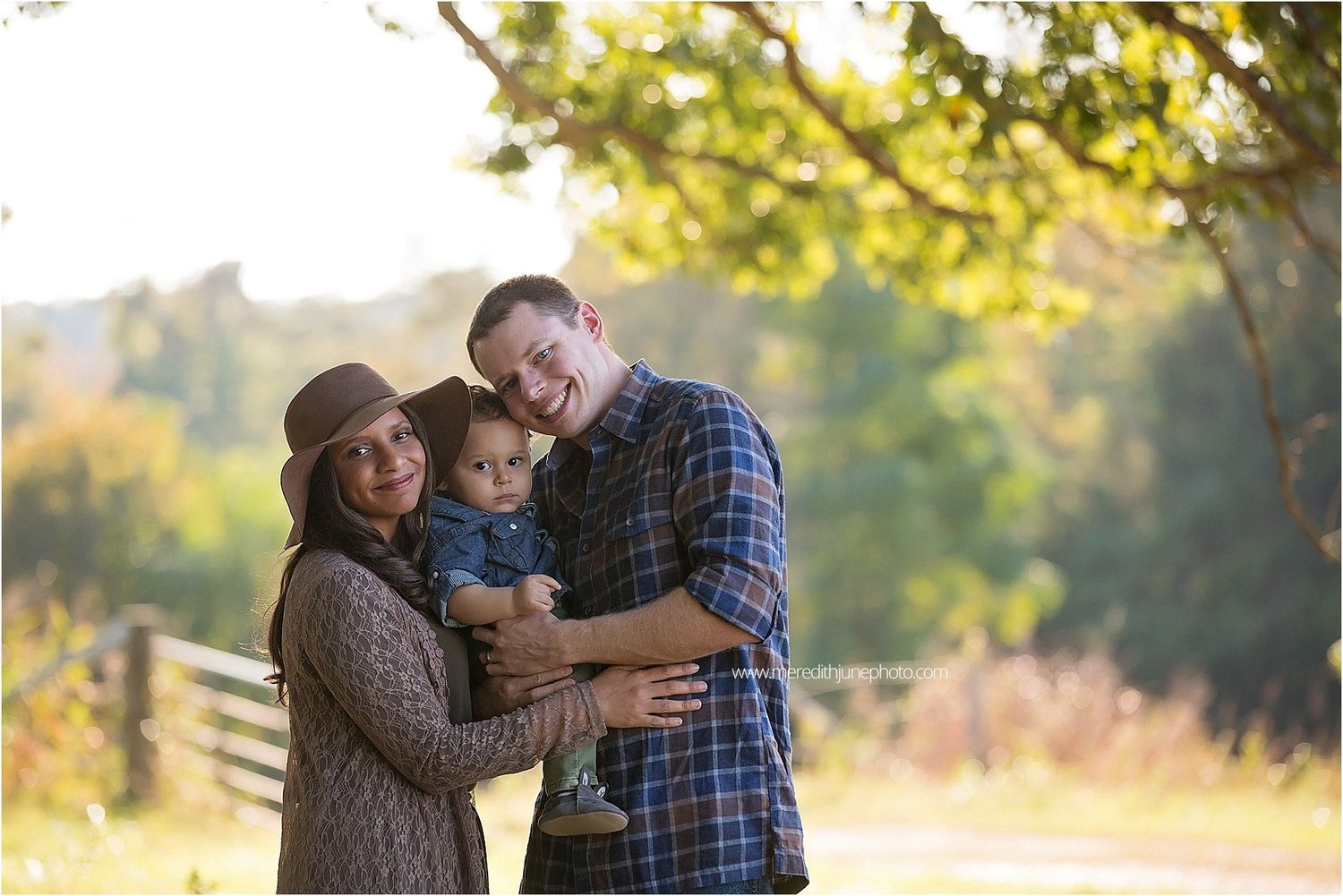 Family members share tender moments together outdoors during a warm autumn evening.