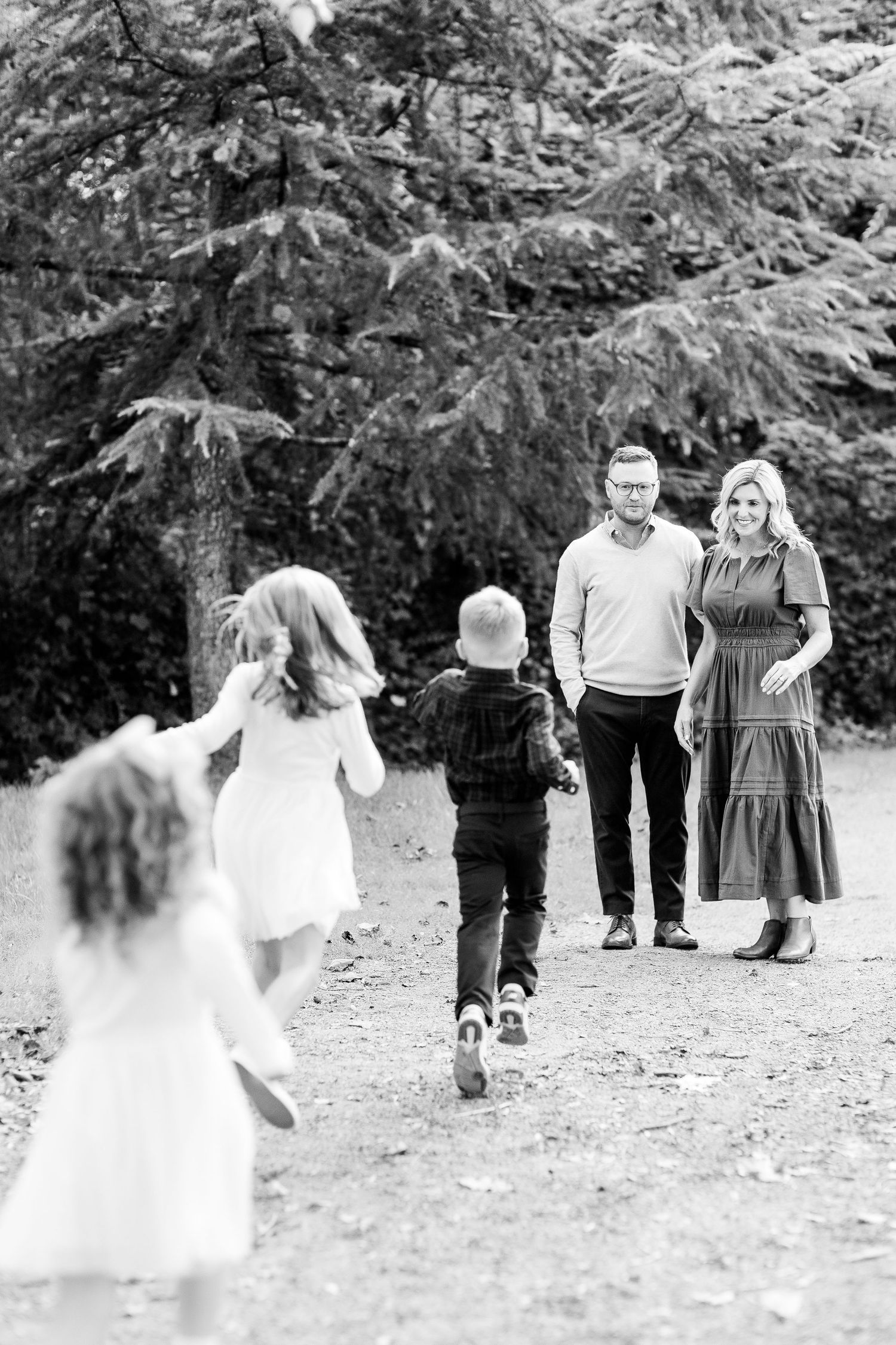 Black and white sequence of outdoor family gathering.