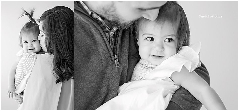 A black and white photo collage showing tender family moments with a baby in various intimate poses and settings.