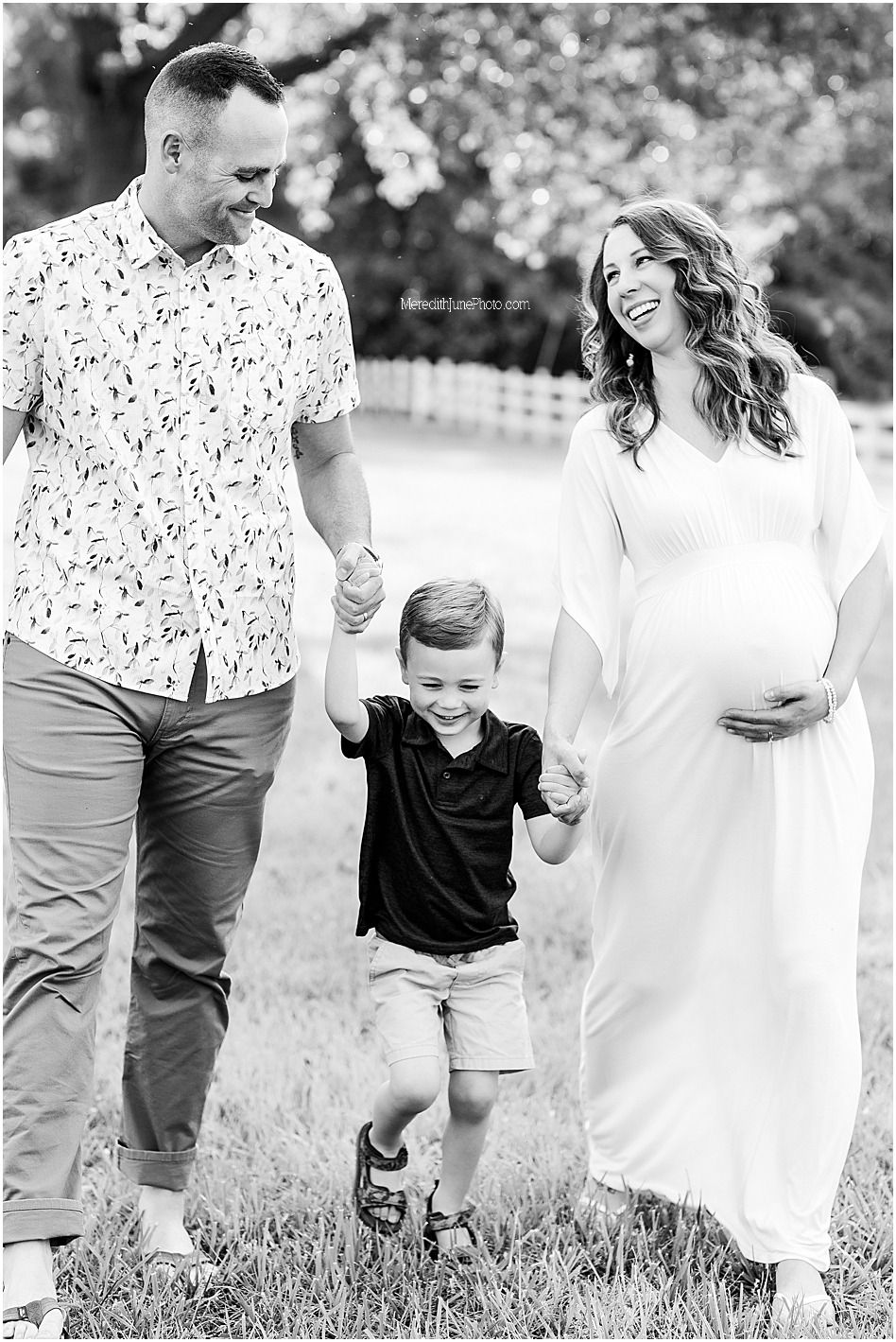 Black and white candid family photos showing joyful moments outdoors in a grassy field.