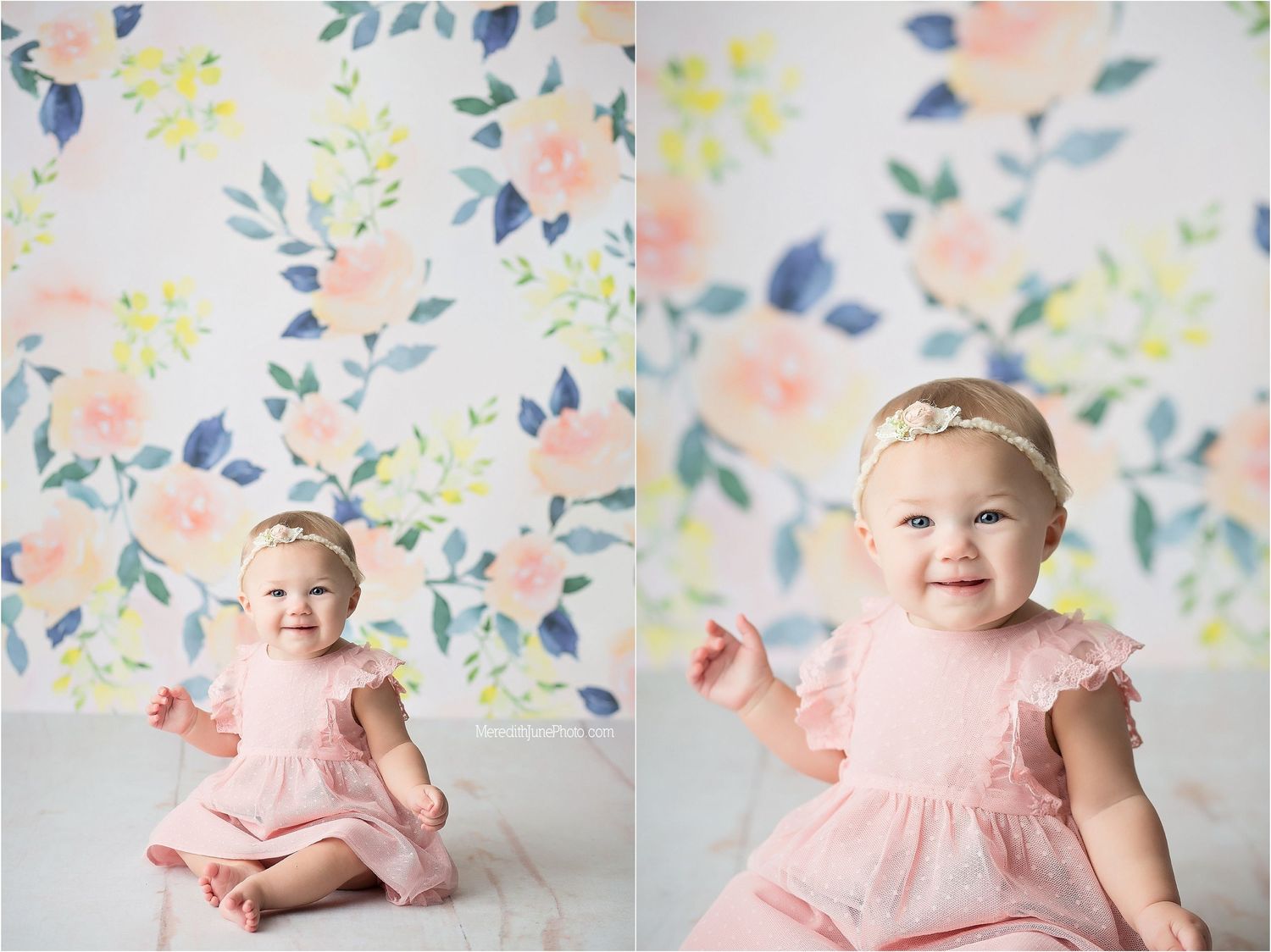 Baby in pink dress sits and plays against floral backdrop in professional photo studio setting.