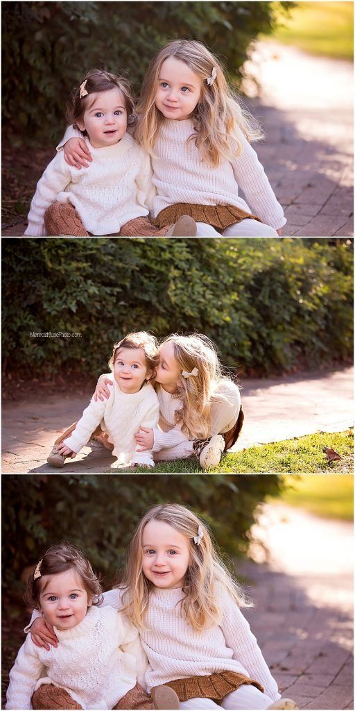 Two children in cream-colored sweaters share sweet moments together outdoors in natural lighting.