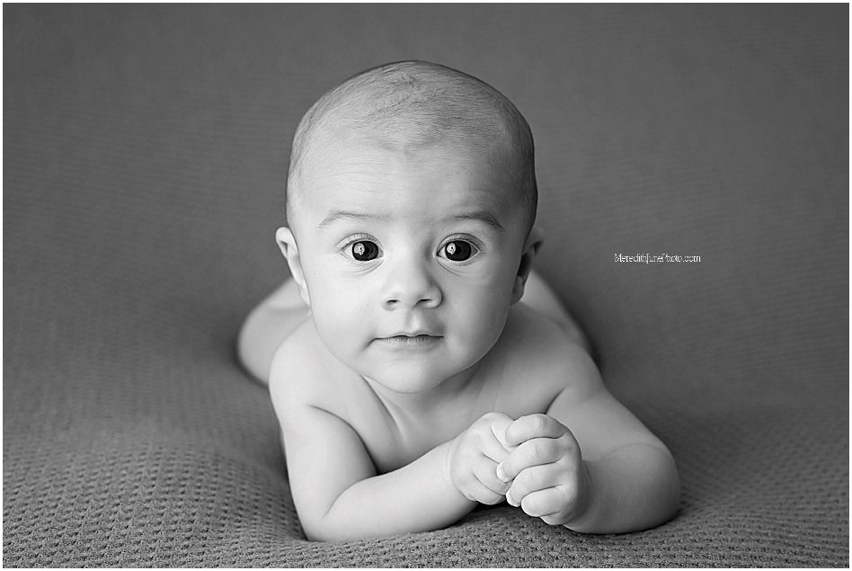 Black and white portrait series showing different expressions and poses on a soft background.