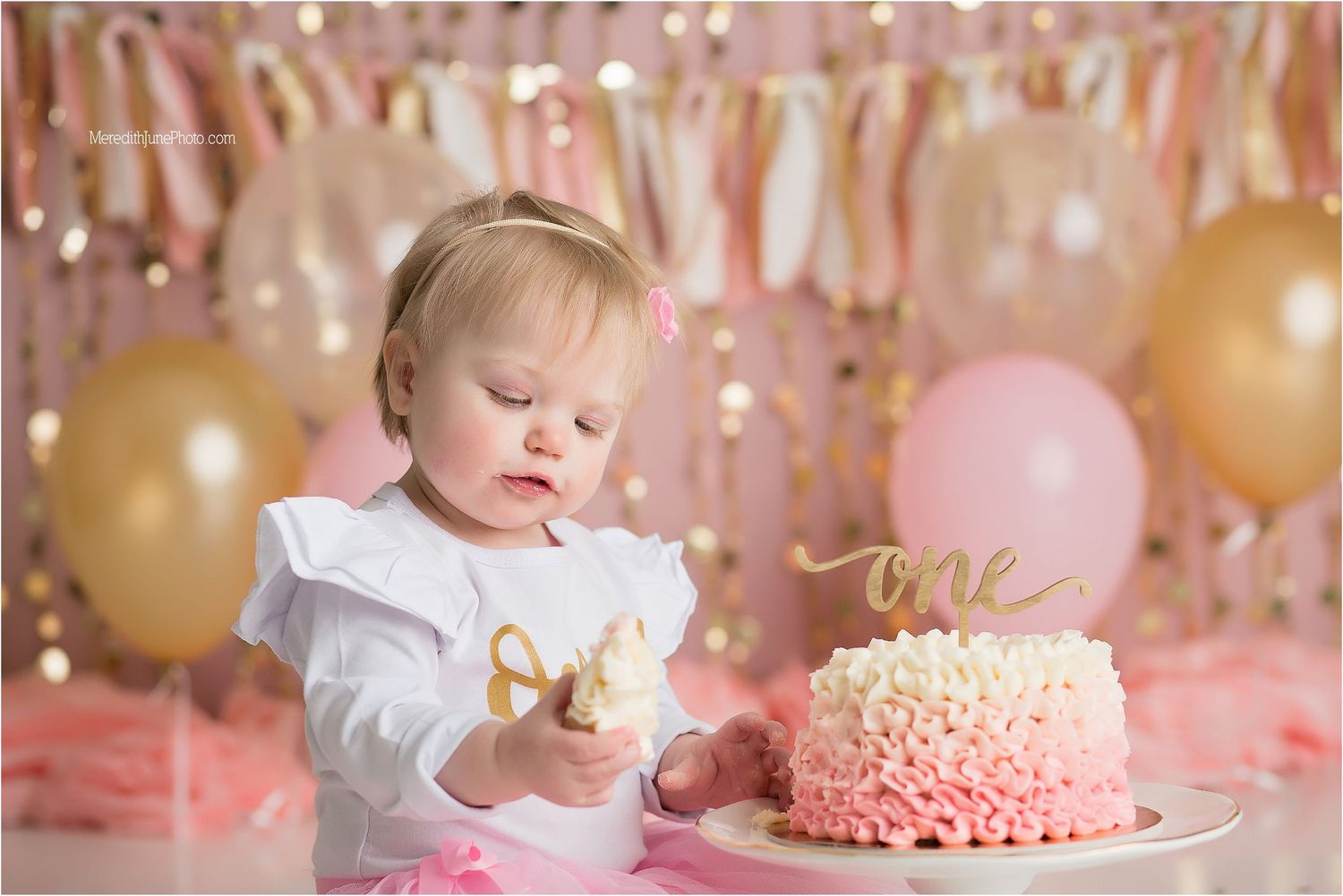 Pink and gold first birthday cake smash photo collage showing decorations, cake, and celebration moments.