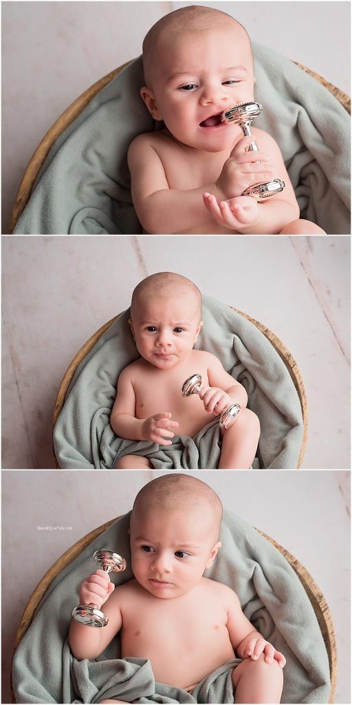 Adorable infant lying on soft mint green blanket in woven basket during professional newborn photography session.