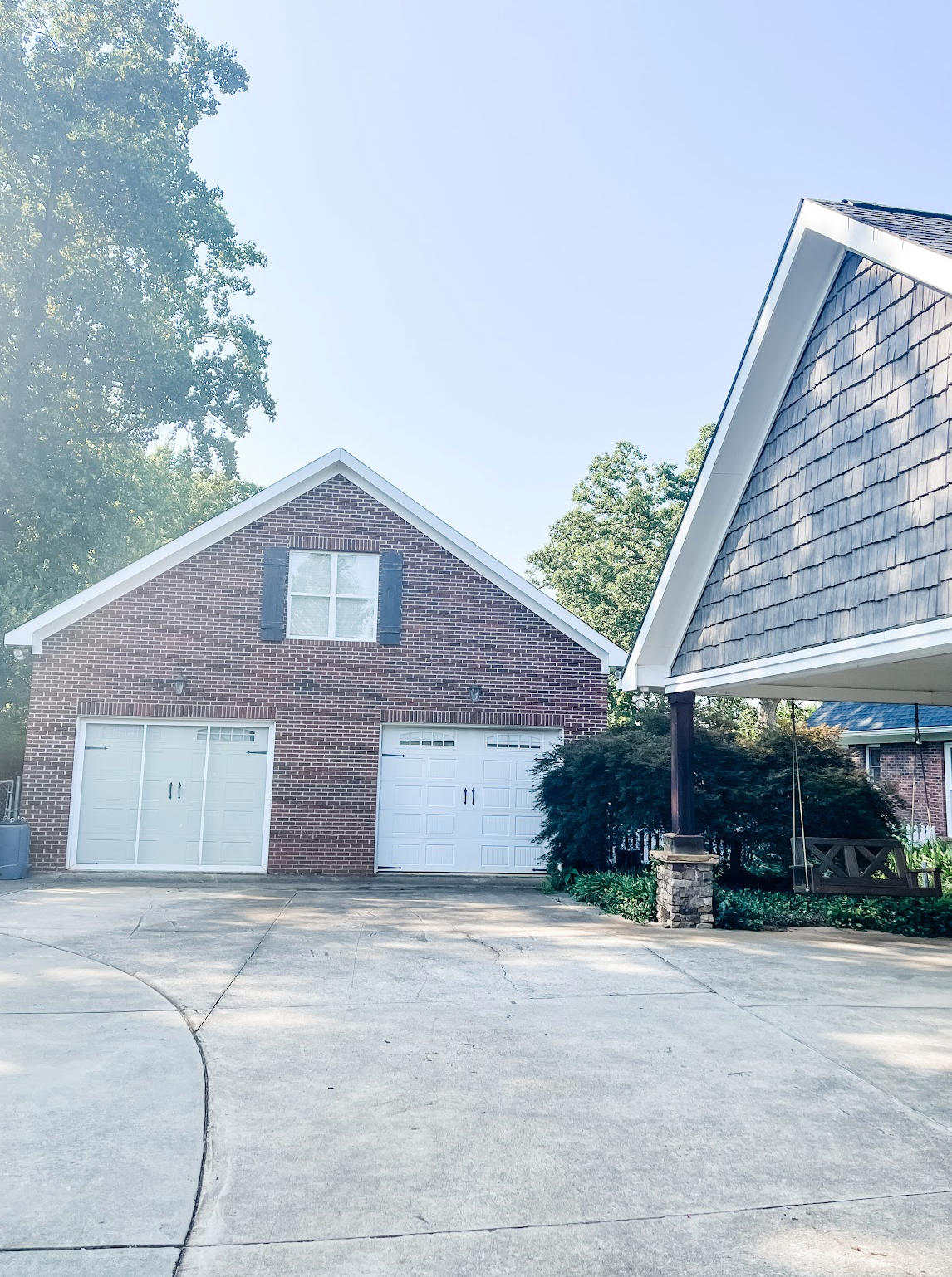 A series of four views showing a red brick house with an attached garage and sloped driveway on a sunny day.