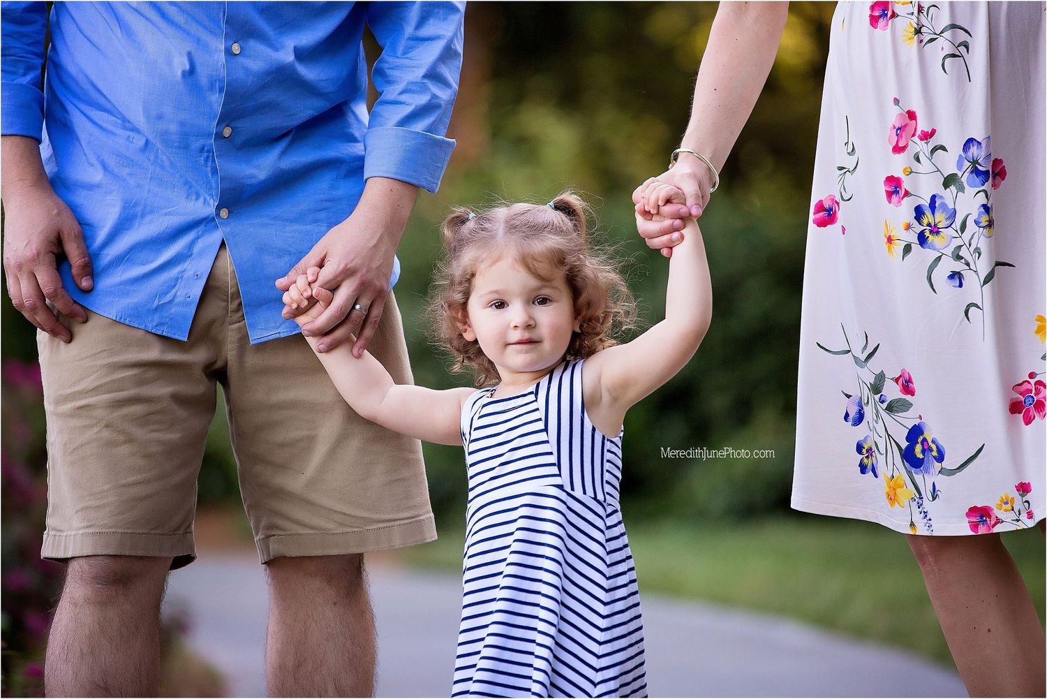 A collage of family photos showing a child in a blue and white striped dress playing outdoors with adults in summer attire.