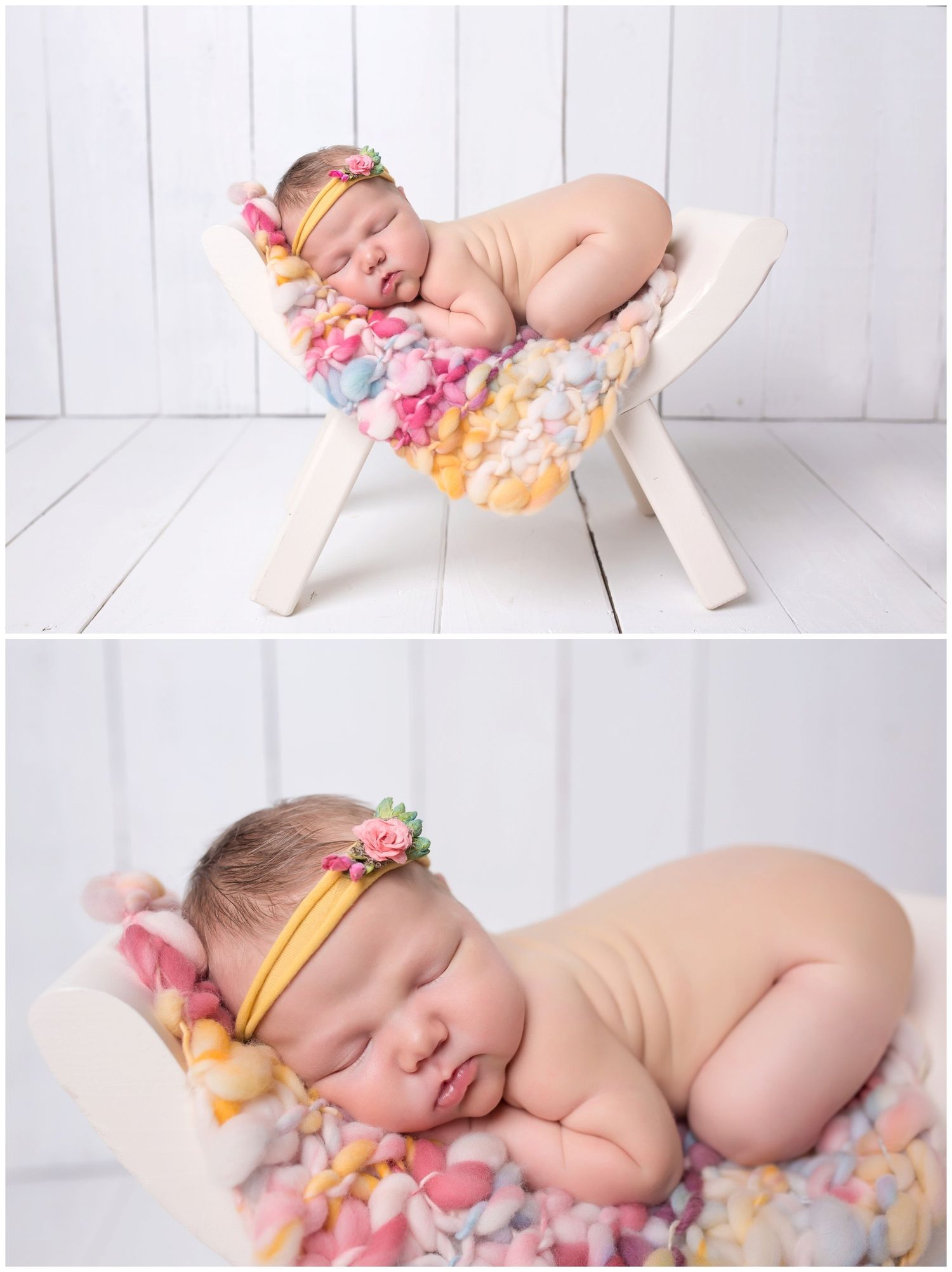 Sleeping newborn posed with delicate pink and orange flowers on white wooden floor.