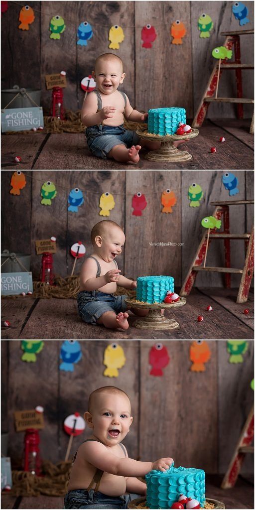 Cake smash photography session with turquoise cake and fishing-themed decorations against rustic wood wall.