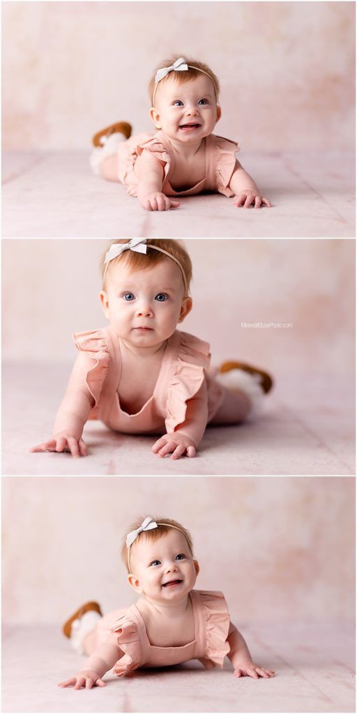 Sweet baby in pink ruffled outfit laying on soft cream backdrop during professional photo session.