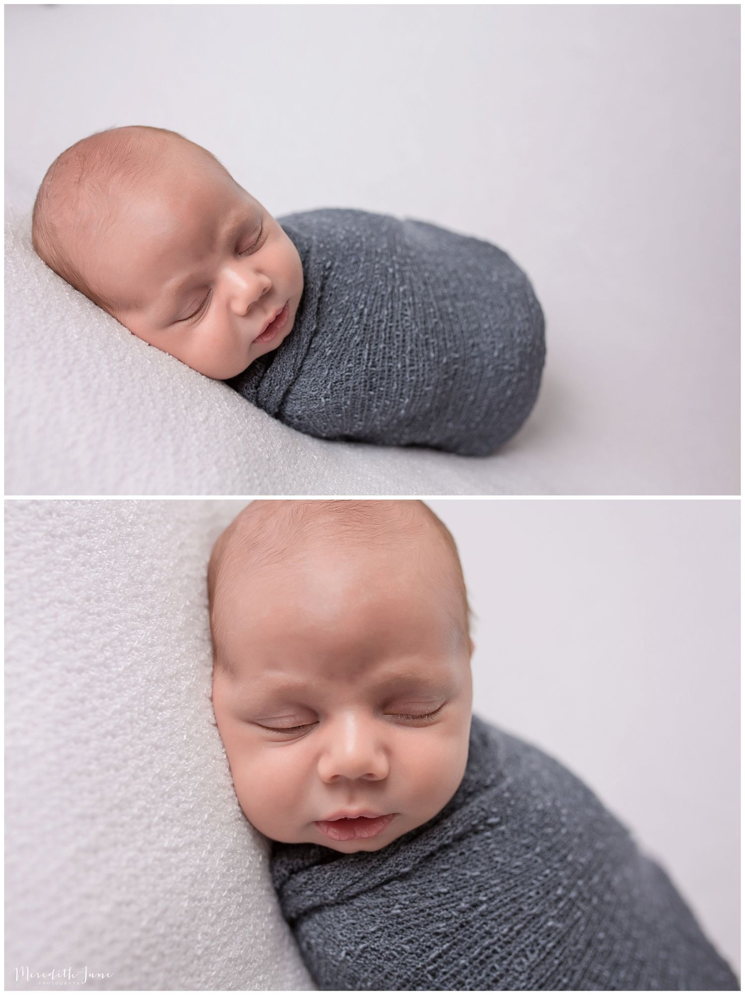 A sleeping newborn baby wrapped in a soft gray swaddle blanket against a white textured backdrop.