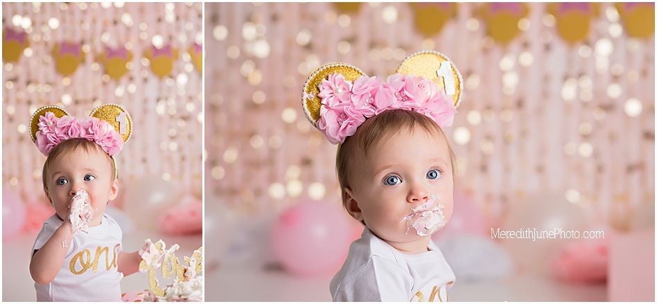 Sweet cake smash portrait session with pink and gold decorations and magical lighting effects.