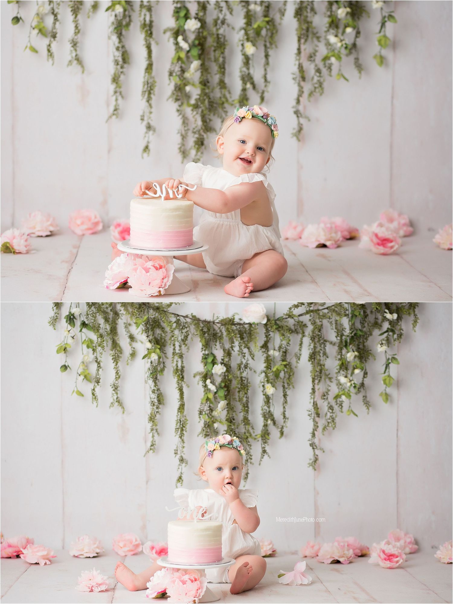 Pink and white cake smash photography setup with hanging greenery and floral decorations against a white backdrop.