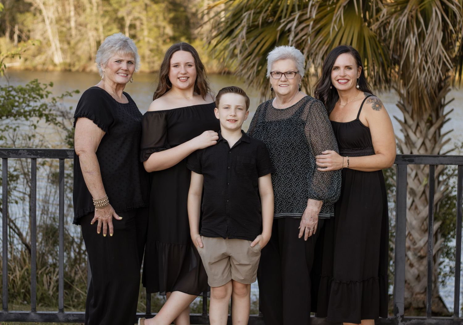Outdoor family portraits captured in a peaceful park setting in Milton, Florida.