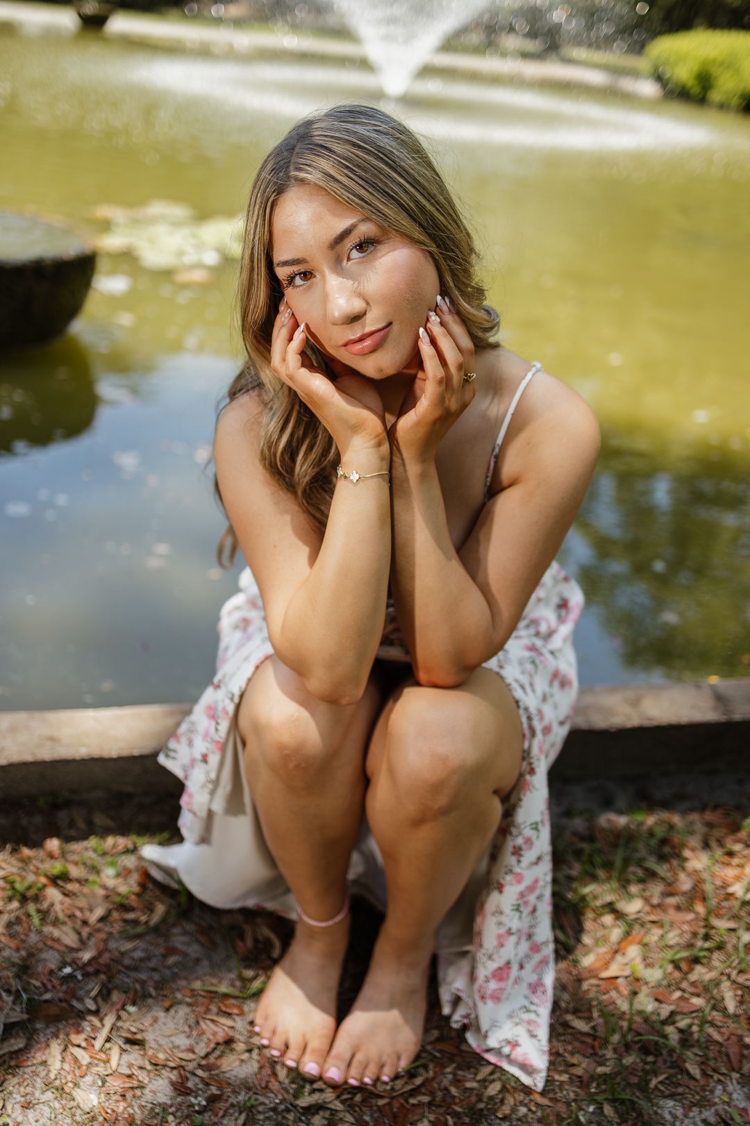 High school senior posing beneath oak trees at Eden Gardens State Park in Santa Rosa Beach Florida.