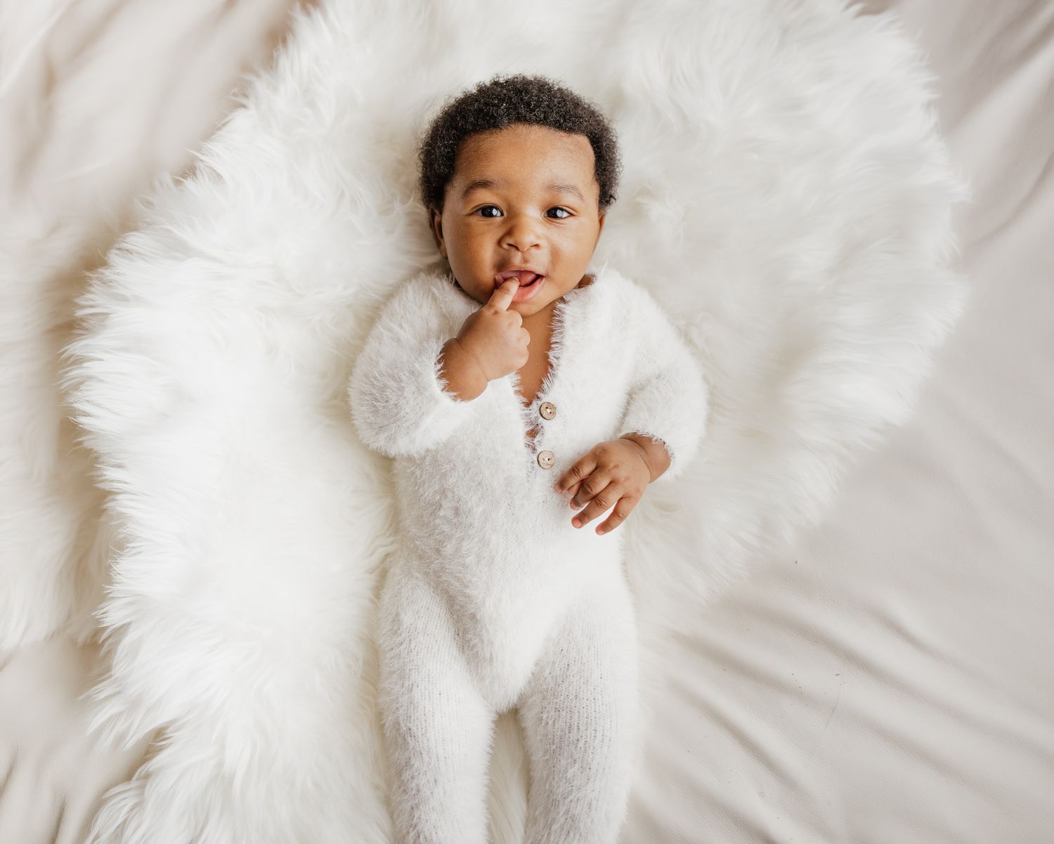 Travel Studio newborn photographer serving Milton, Pensacola, Pace, and surrounding Northwest Florida areas.