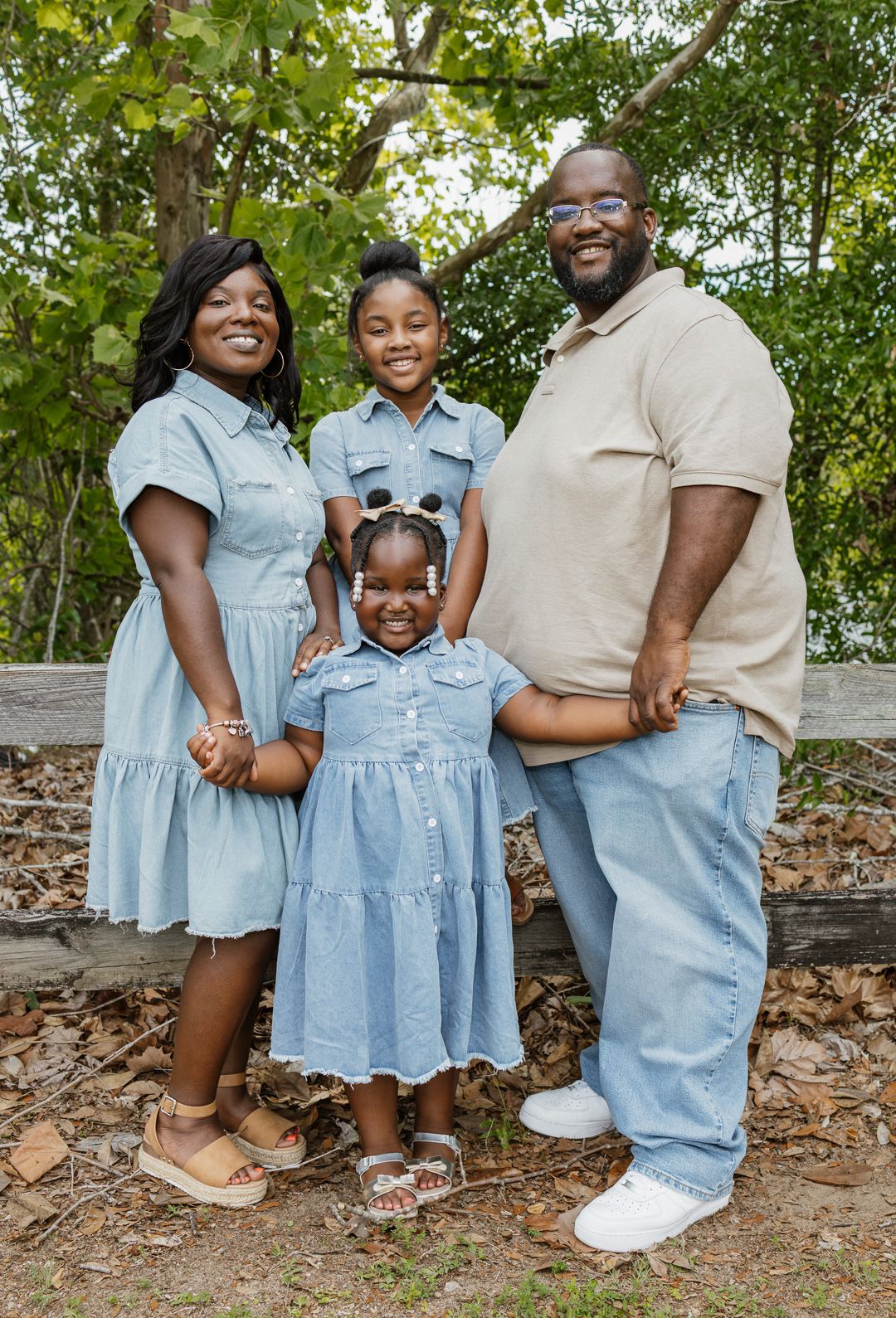 Outdoor family portraits captured in a peaceful park setting in Bagdad, Florida.