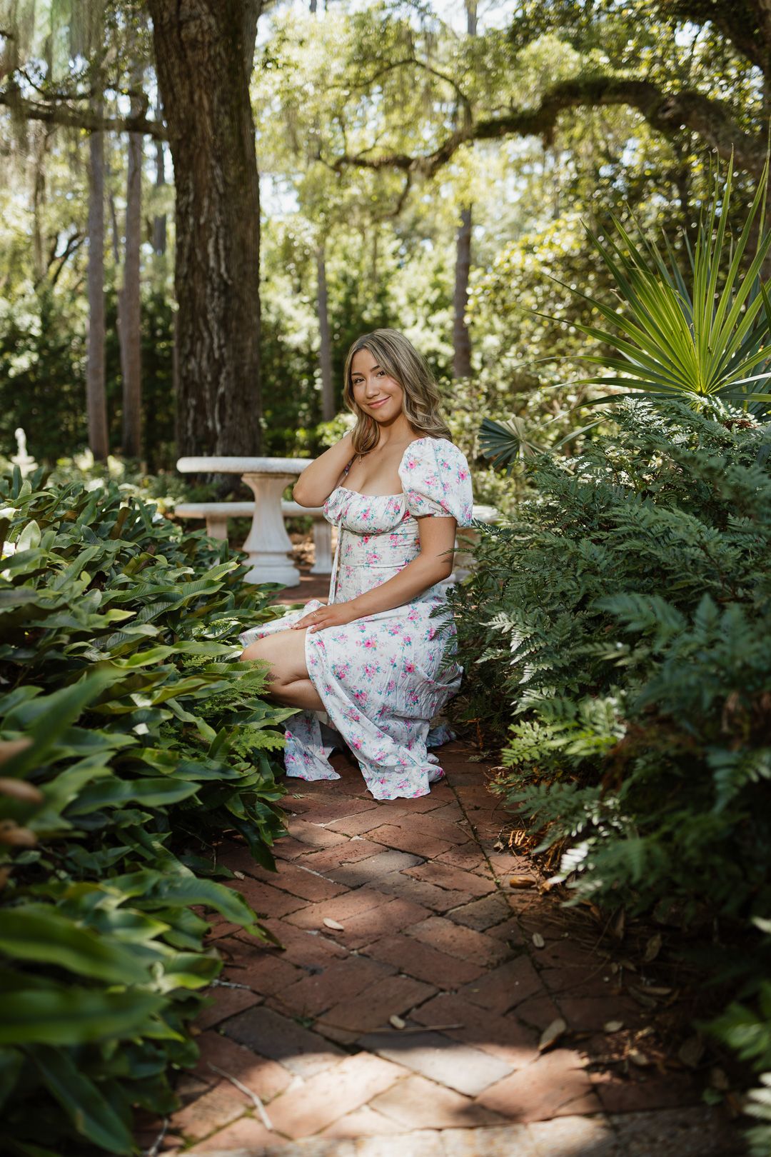 High school senior posing beneath oak trees at Eden Gardens State Park in Santa Rosa Beach Florida.