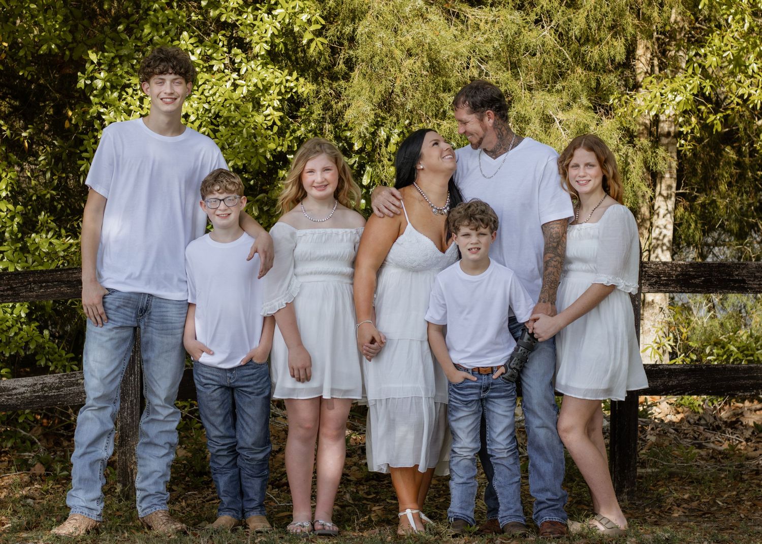 Outdoor family portraits captured in a peaceful park setting in Bagdad, Florida.