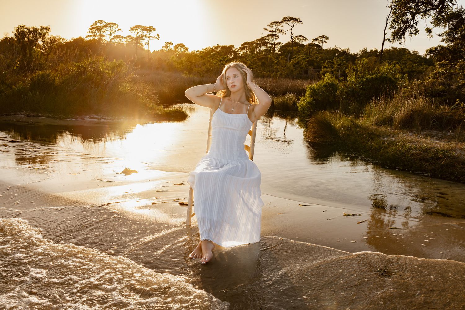 Pensacola Beach senior photography session featuring a graduate posing by the water