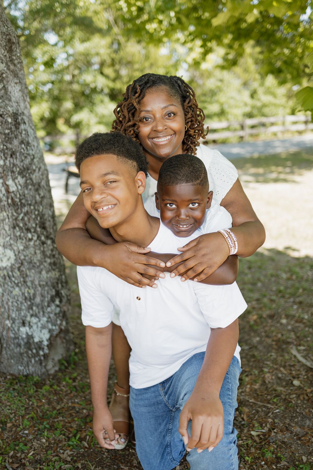 Outdoor family portraits captured in a peaceful park setting in Bagdad, Florida.