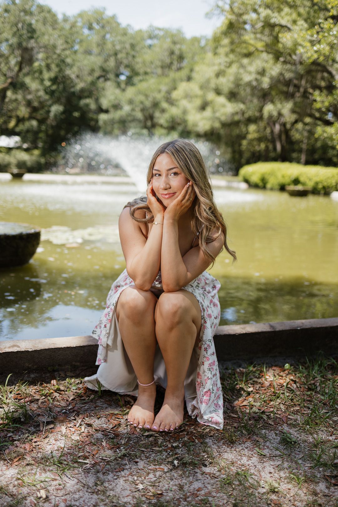 High school senior posing beneath oak trees at Eden Gardens State Park in Santa Rosa Beach Florida.