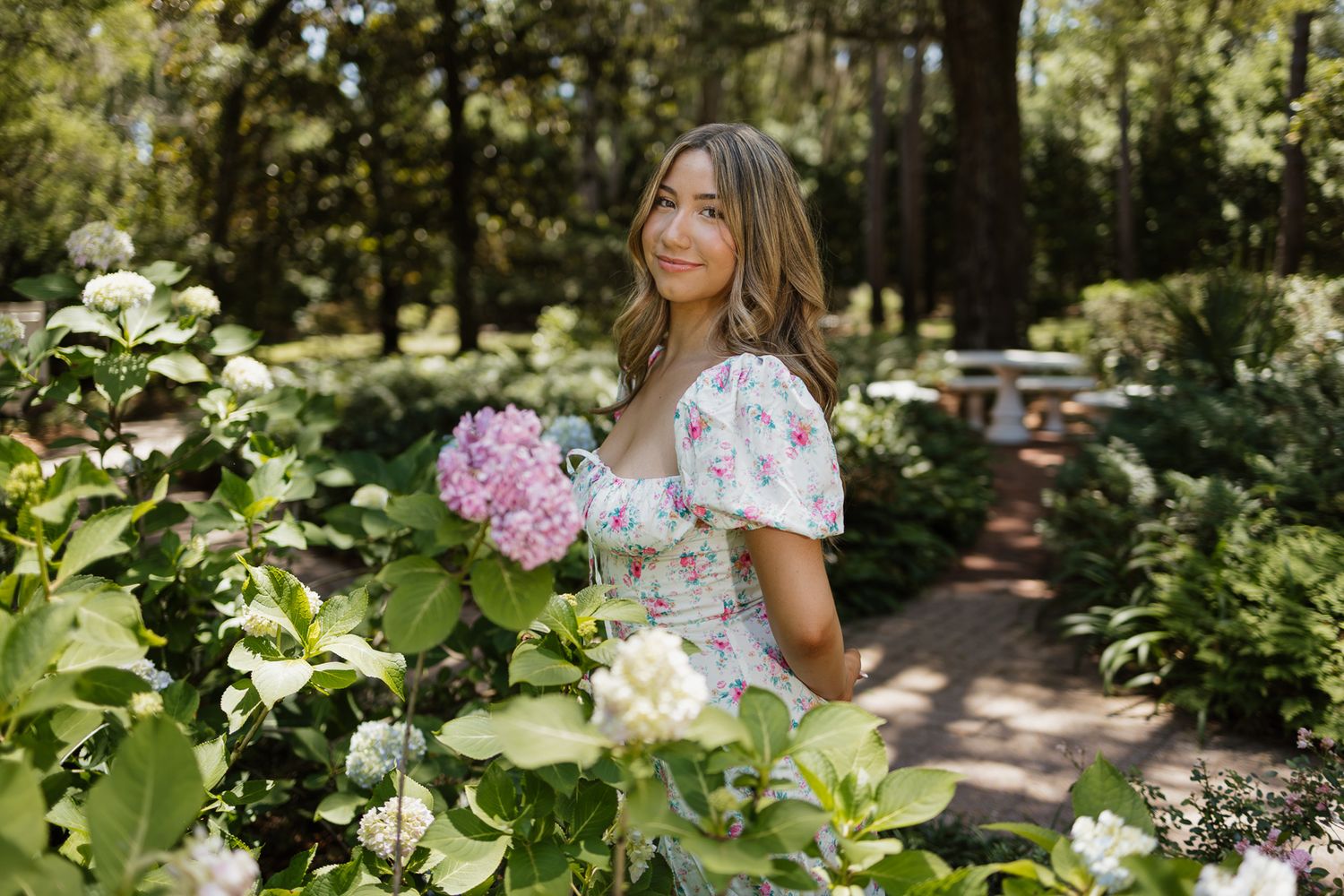 High school senior posing beneath oak trees at Eden Gardens State Park in Santa Rosa Beach Florida.