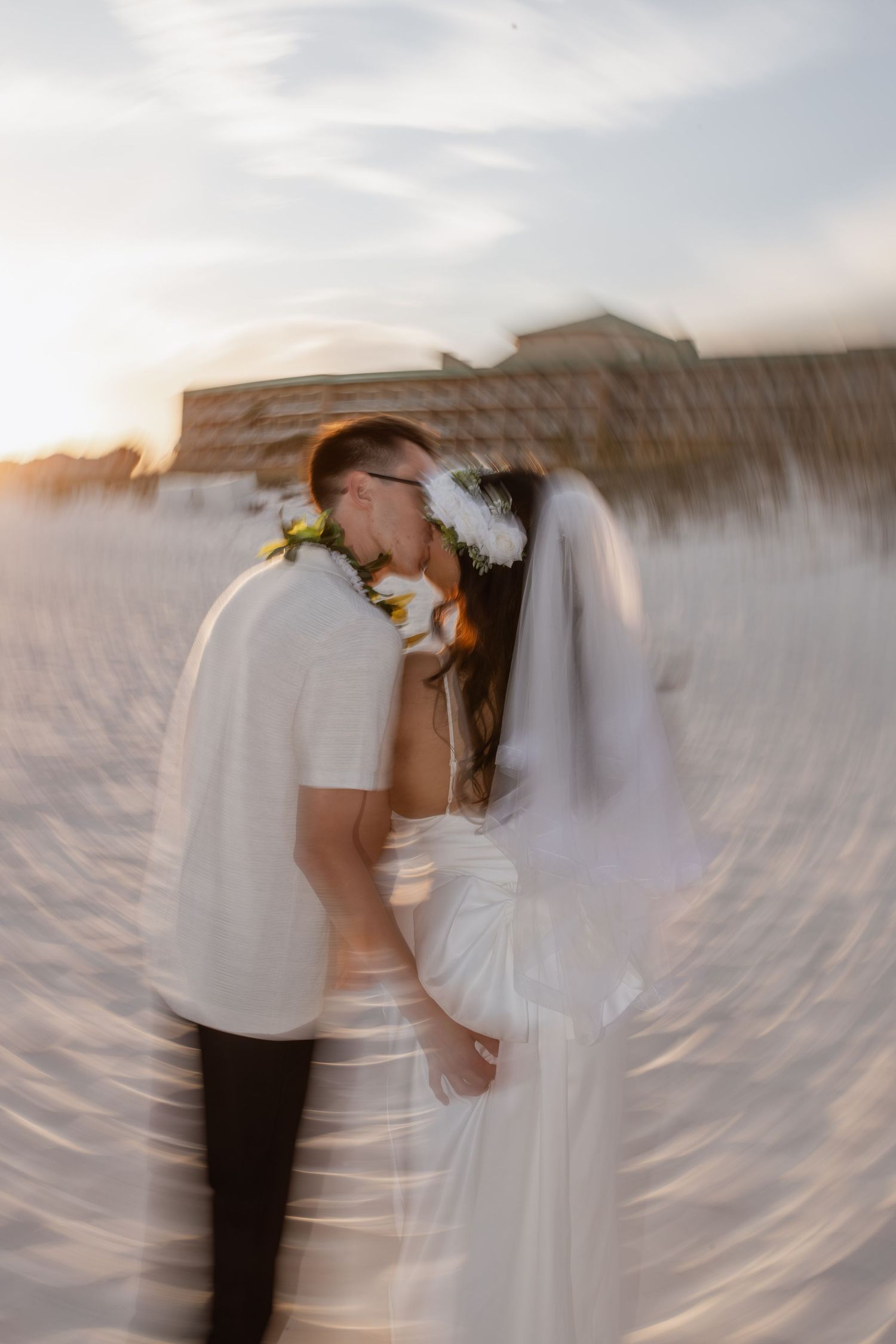 Intimate wedding ceremony on the white sands of Pensacola Beach, Florida.