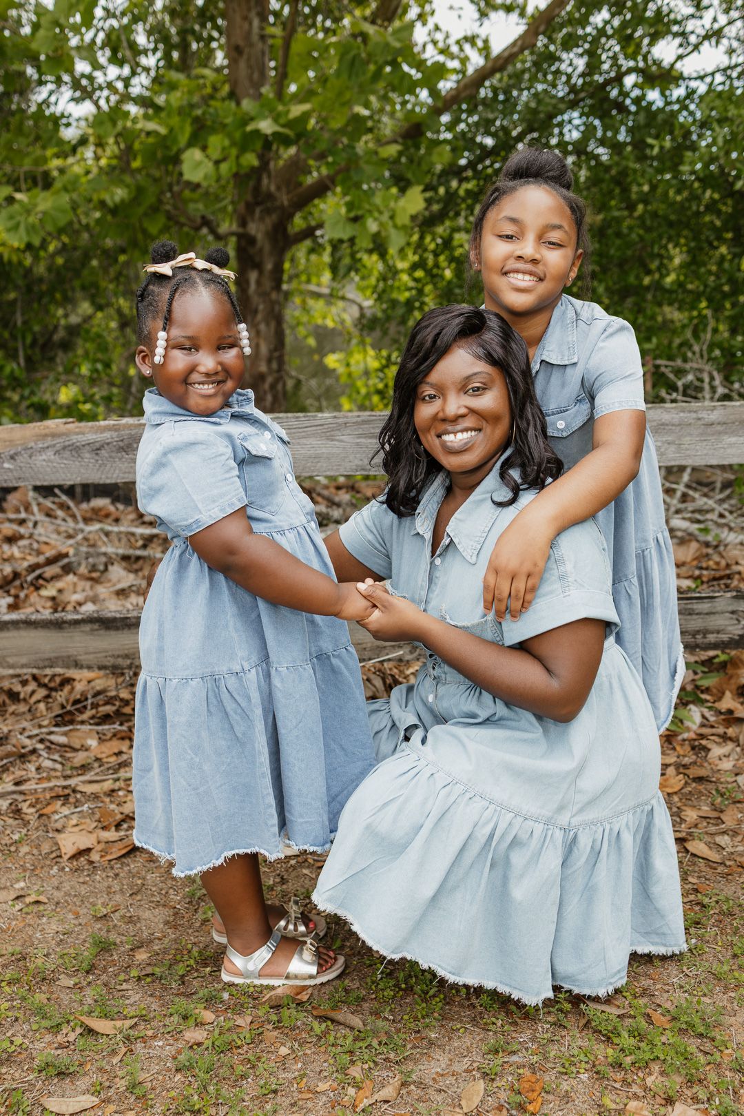 Outdoor family portraits captured in a peaceful park setting in Bagdad, Florida.