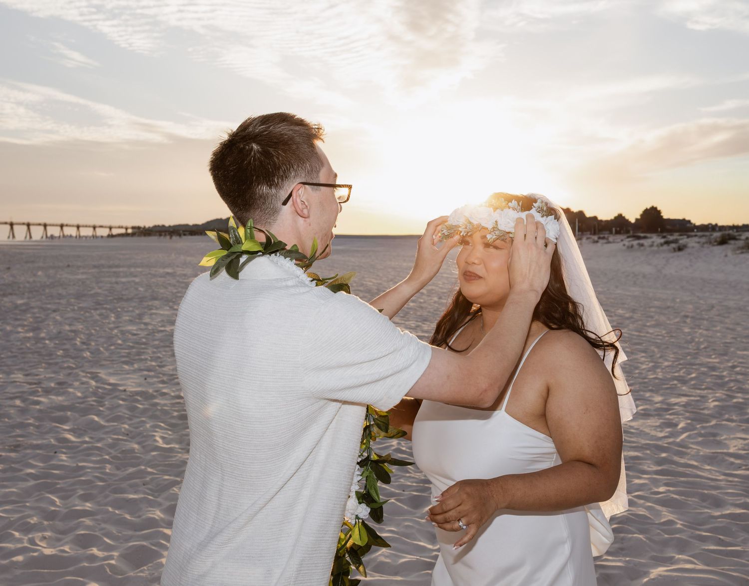Intimate wedding ceremony on the white sands of Pensacola Beach, Florida.