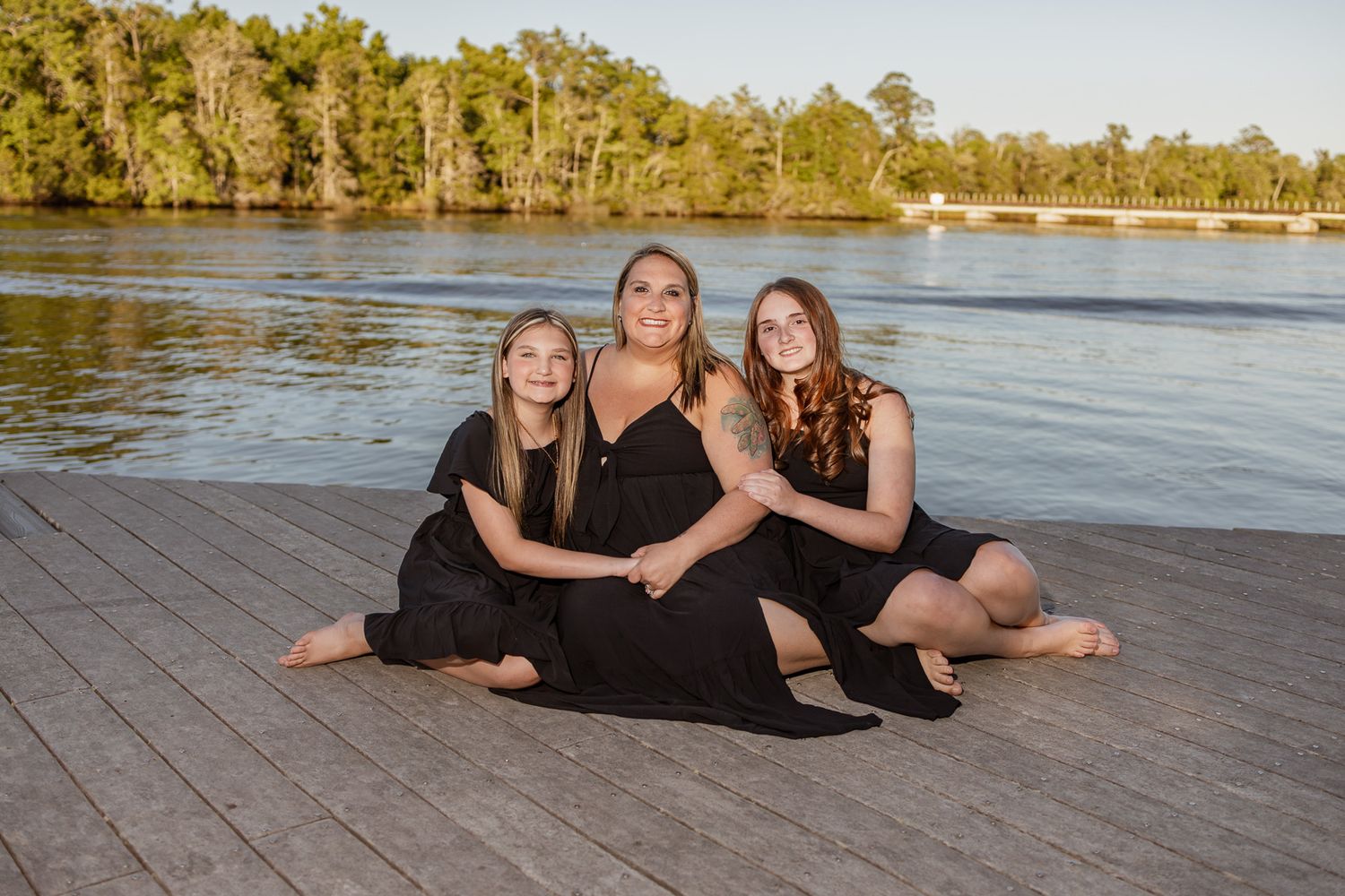 Outdoor family portraits captured in a peaceful park setting in Milton, Florida.