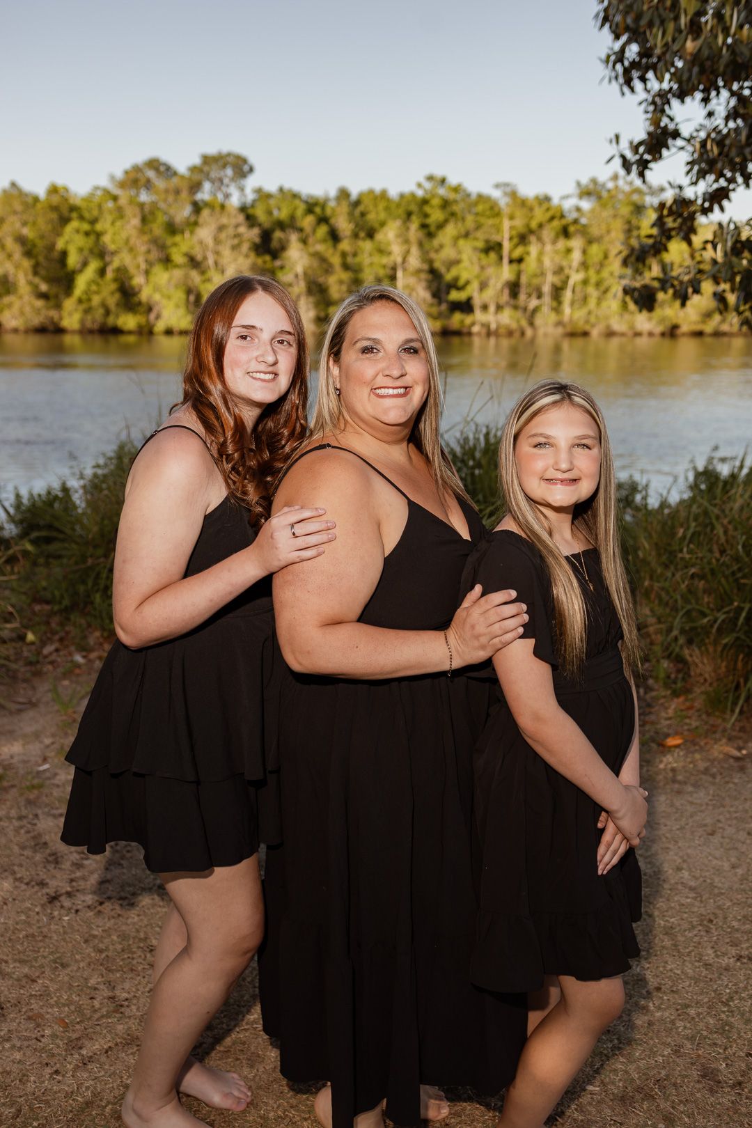 Outdoor family portraits captured in a peaceful park setting in Milton, Florida.