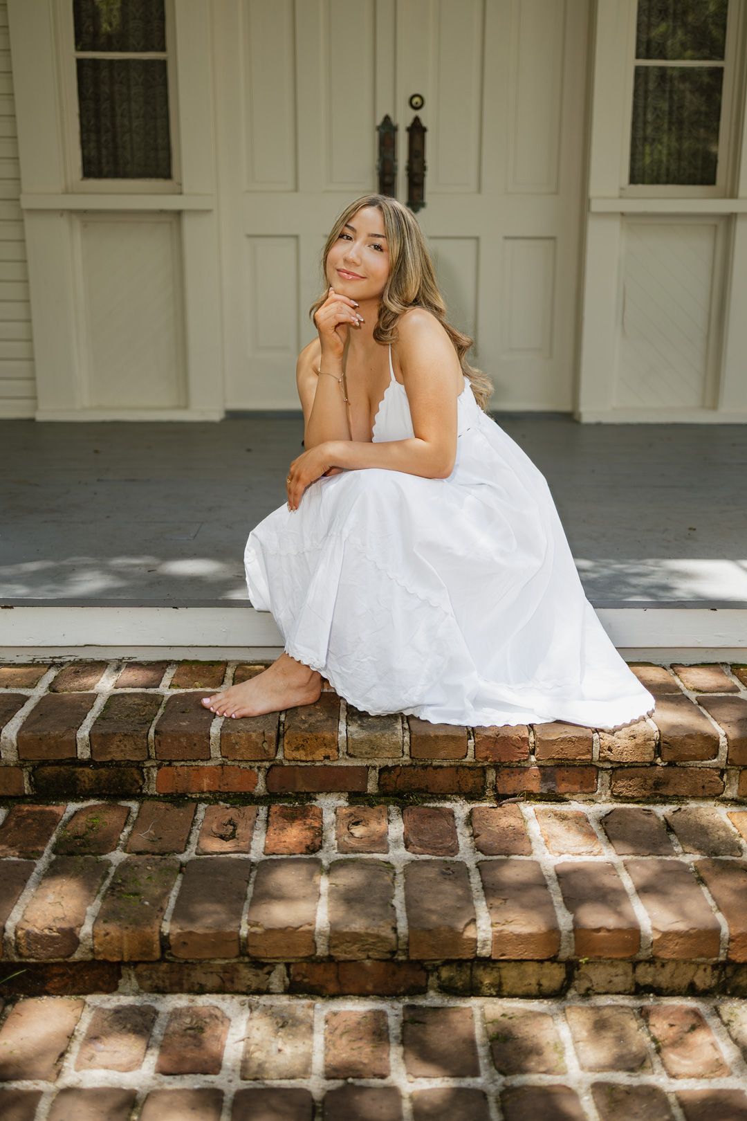 High school senior posing beneath oak trees at Eden Gardens State Park in Santa Rosa Beach Florida.