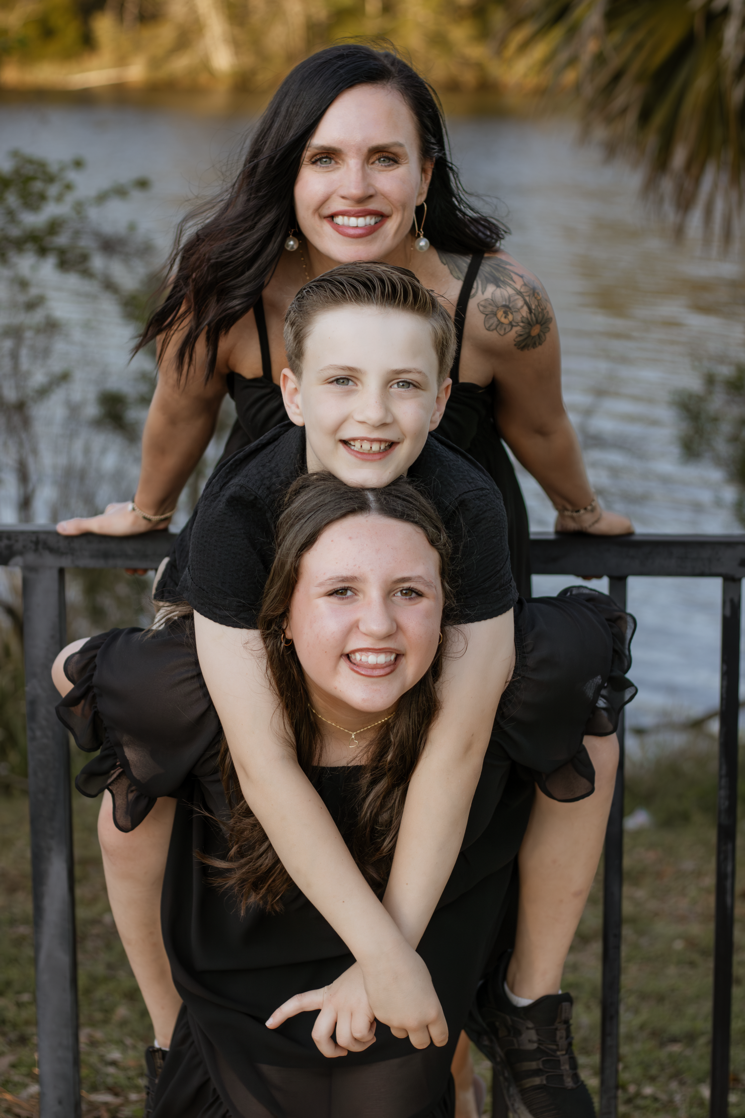 Outdoor family portraits captured in a peaceful park setting in Milton, Florida.