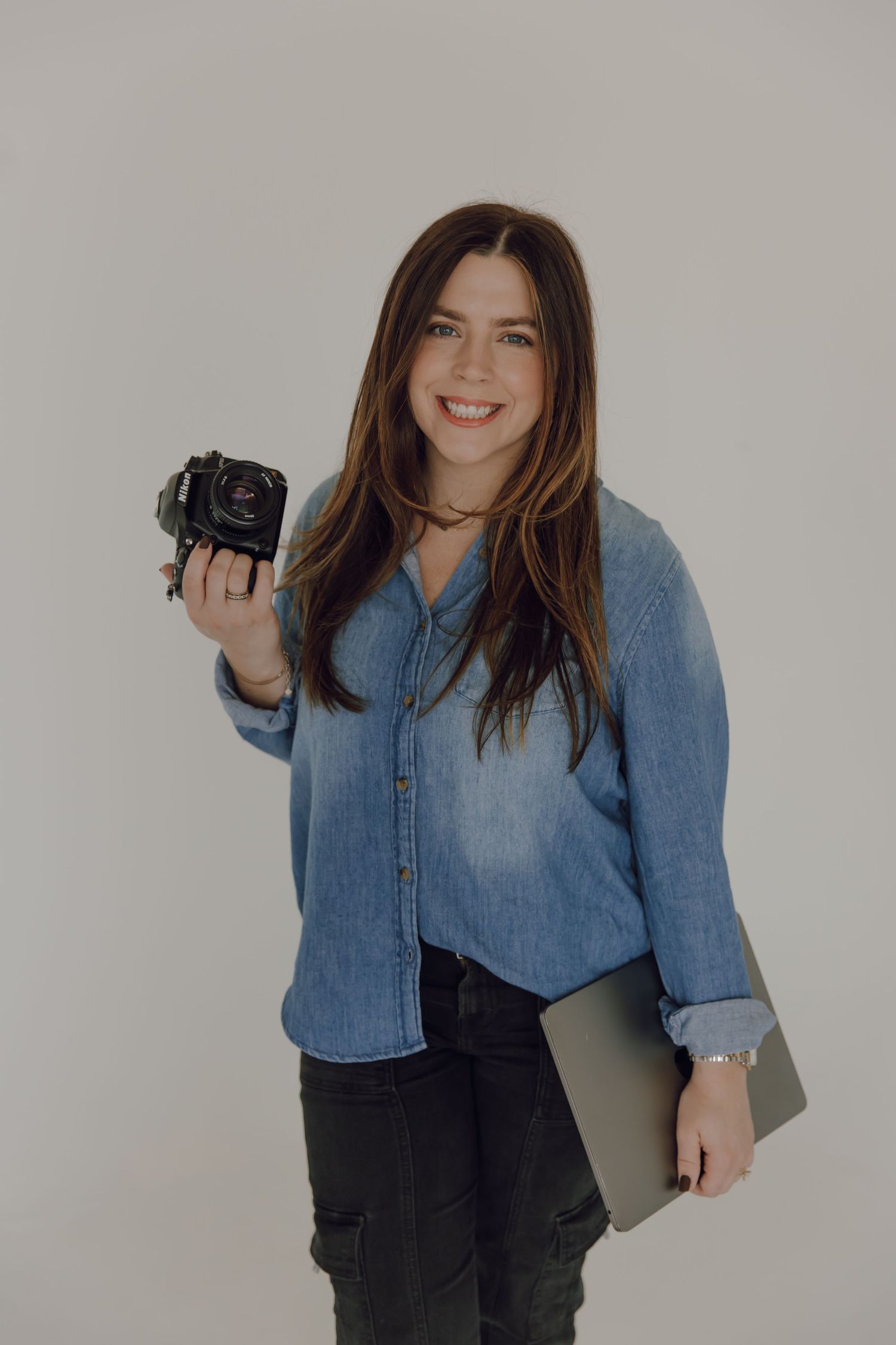 Casual denim and black fashion photography session in studio setting.