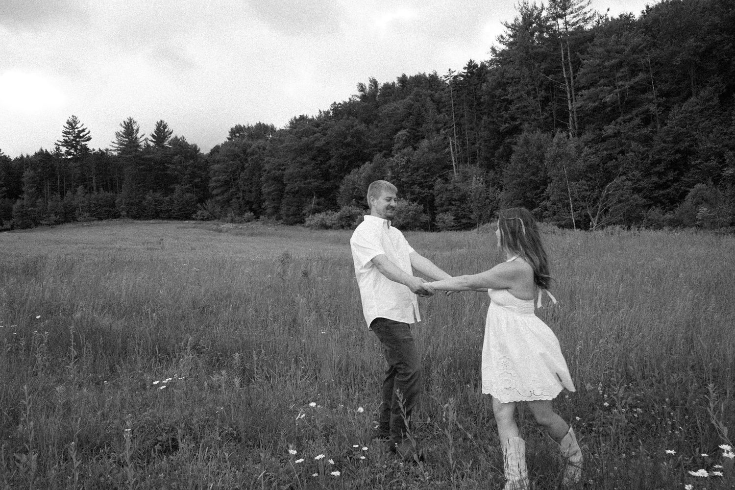 black and white image of couple in field