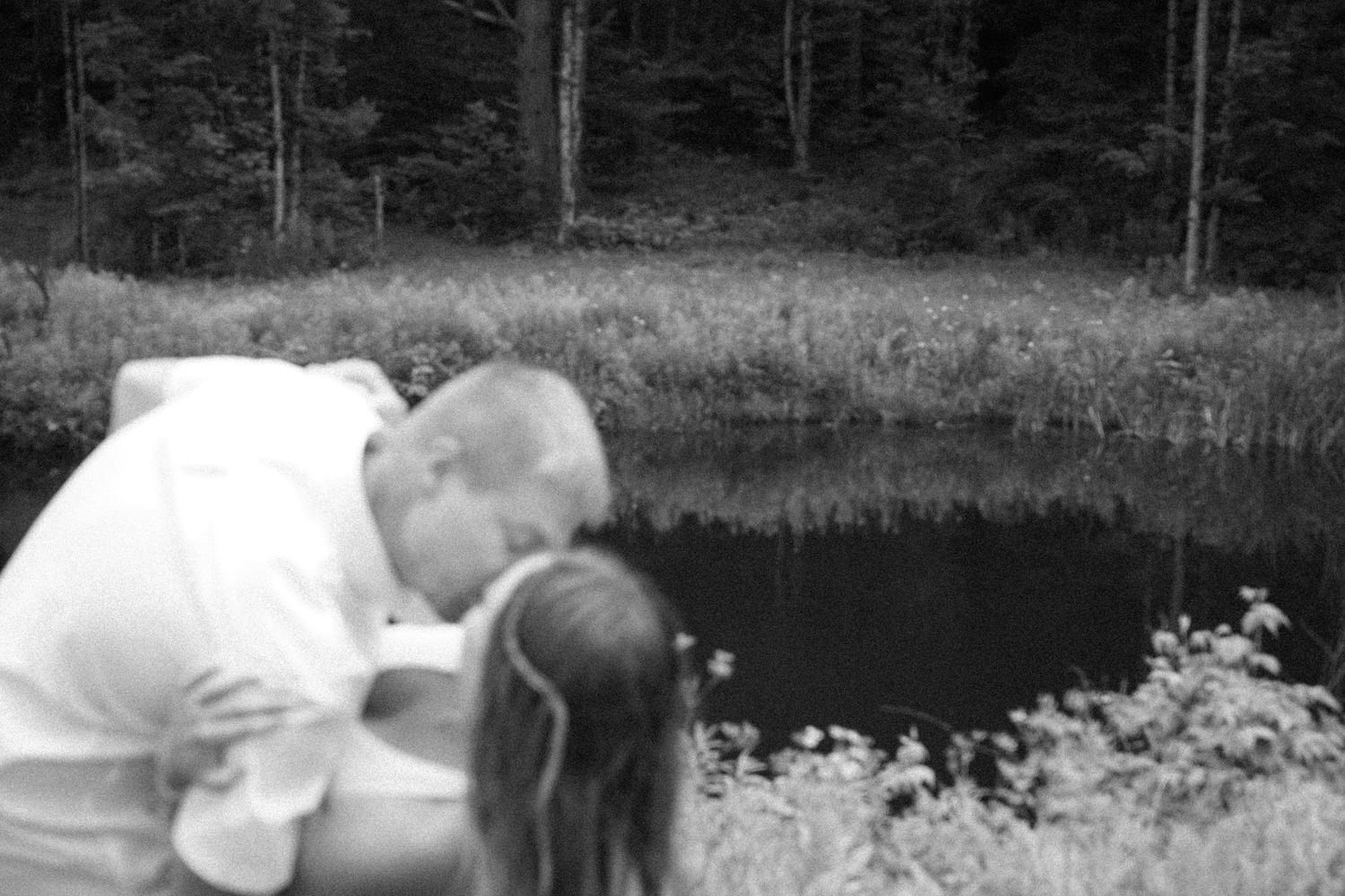 Black and white image of couple kissing