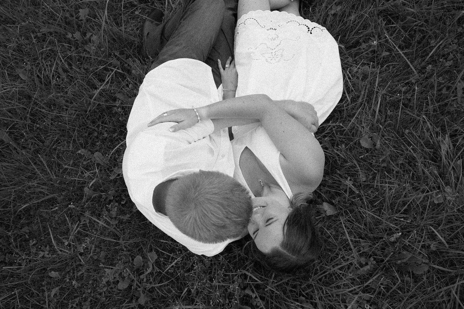 black and white image of couple in field