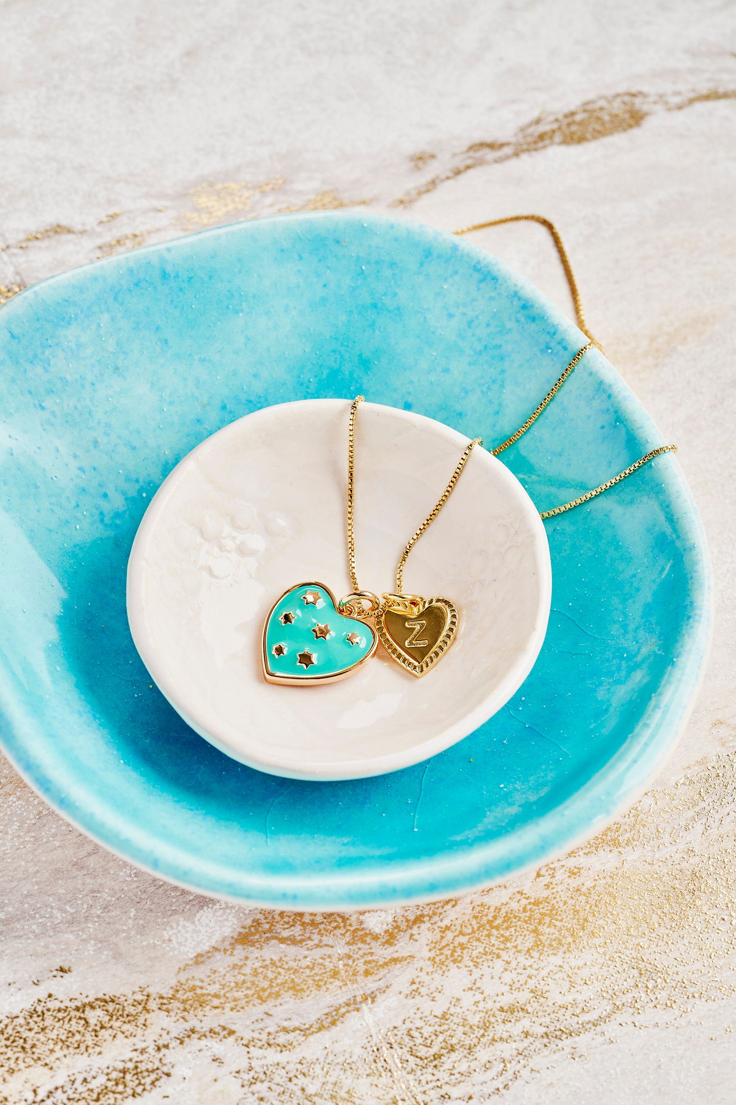 Gold and blue necklace shot for Patroula Jewellery