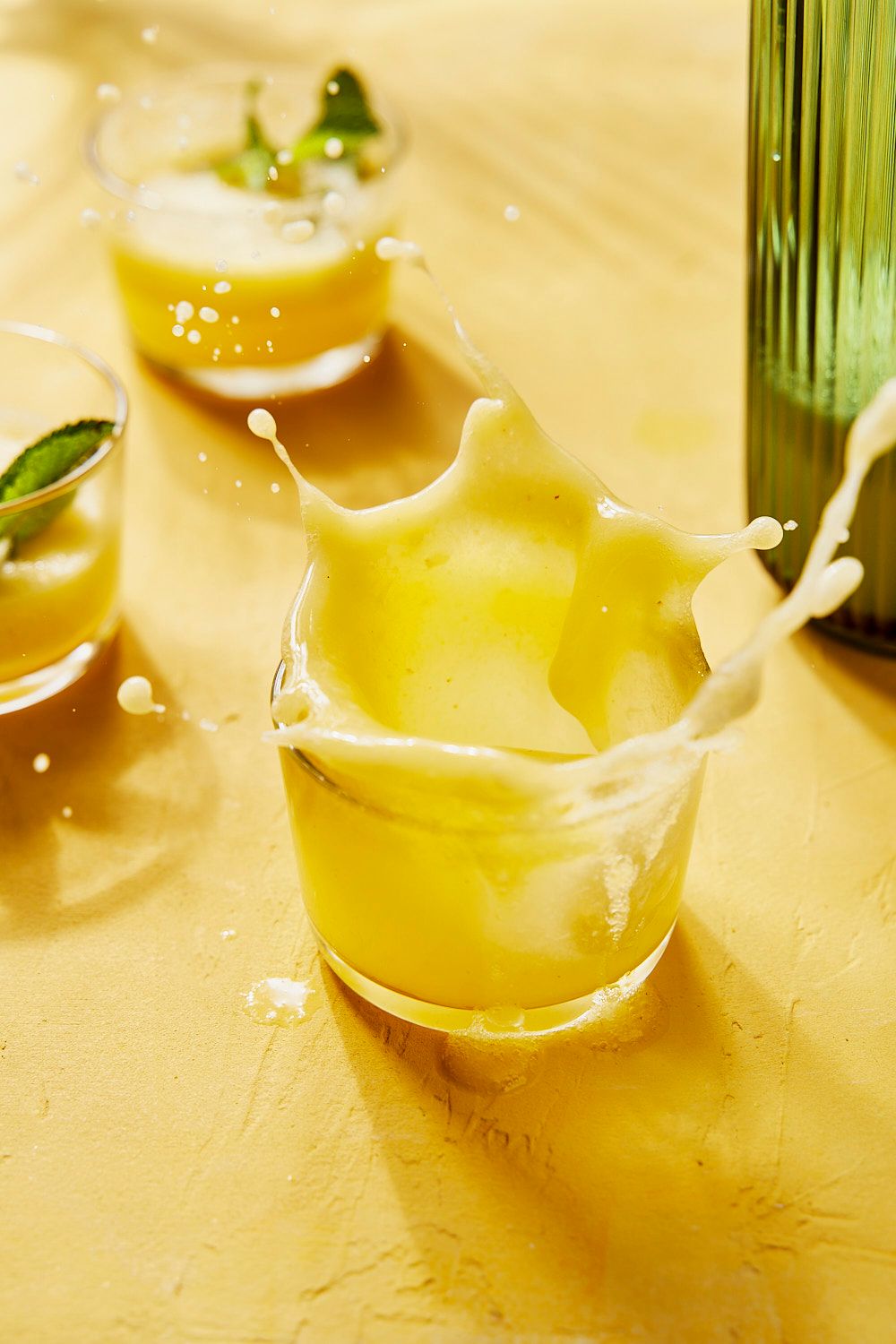 Lemon G&T splash on yellow background